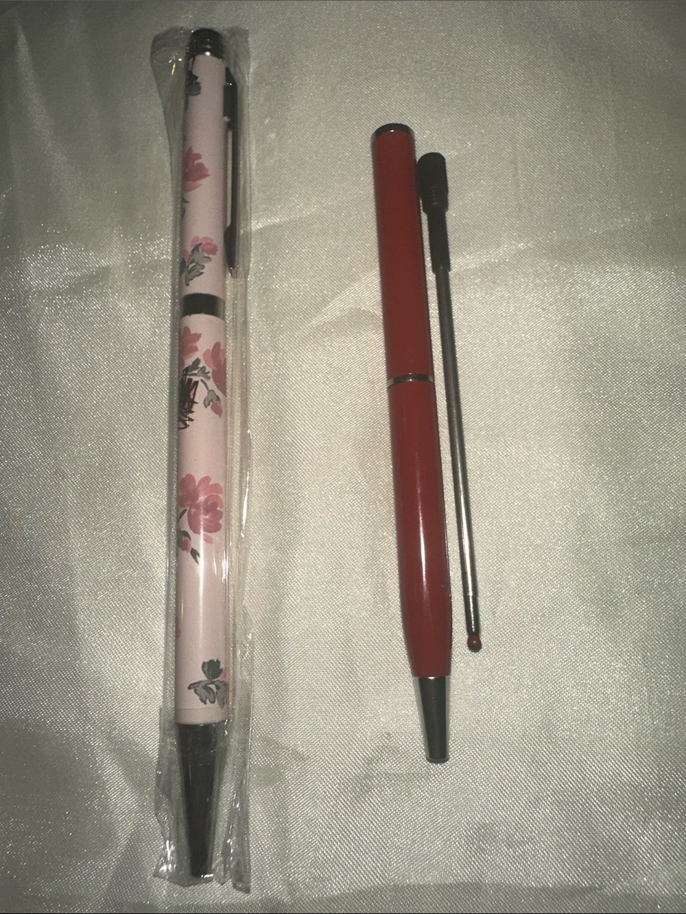 Lot of two Coach Pink Floral and small red pen w/extra refill